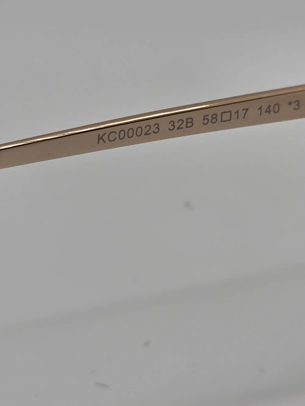 Kenneth Cole Rose Gold Aviator Sunglasses with Dark Gradient Lenses